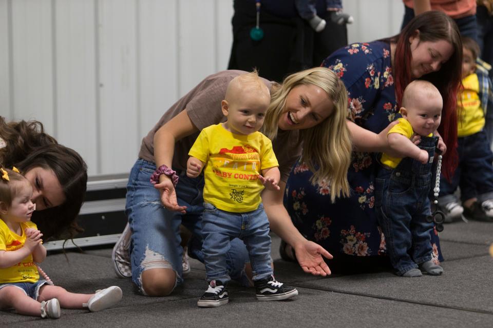 Families and friends attend the annual baby contest at the Washington County Fair Saturday, April 23, 2022. 