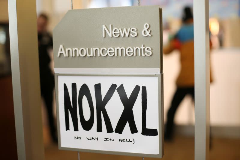 FILE PHOTO: A sign opposing the Keystone XL Pipeline is seen inside of a Chase Bank location while Native American leaders and climate activists demonstrate in Seattle, Washington