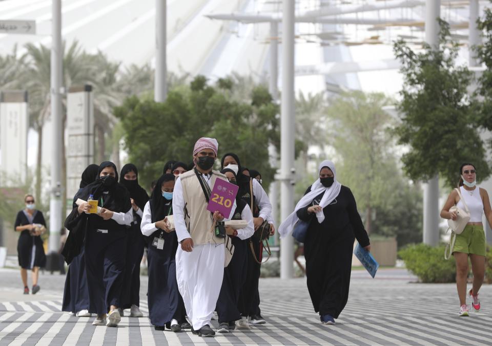 Students follow their guide during a visit to the Dubai Expo 2020, in Dubai, United Arab Emirates, Sunday, Oct, 3, 2021. (AP Photo/Kamran Jebreili)