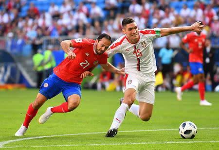 Soccer Football - World Cup - Group E - Costa Rica vs Serbia - Samara Arena, Samara, Russia - June 17, 2018 Serbia's Nikola Milenkovic in action with Costa Rica's Marco Urena REUTERS/Dylan Martinez