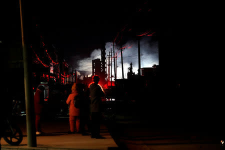 Villagers stand outside their damaged houses following an explosion at a pesticide plant owned by Tianjiayi Chemical, in Xiangshui county, Yancheng, Jiangsu province, China March 22, 2019. REUTERS/Aly Song