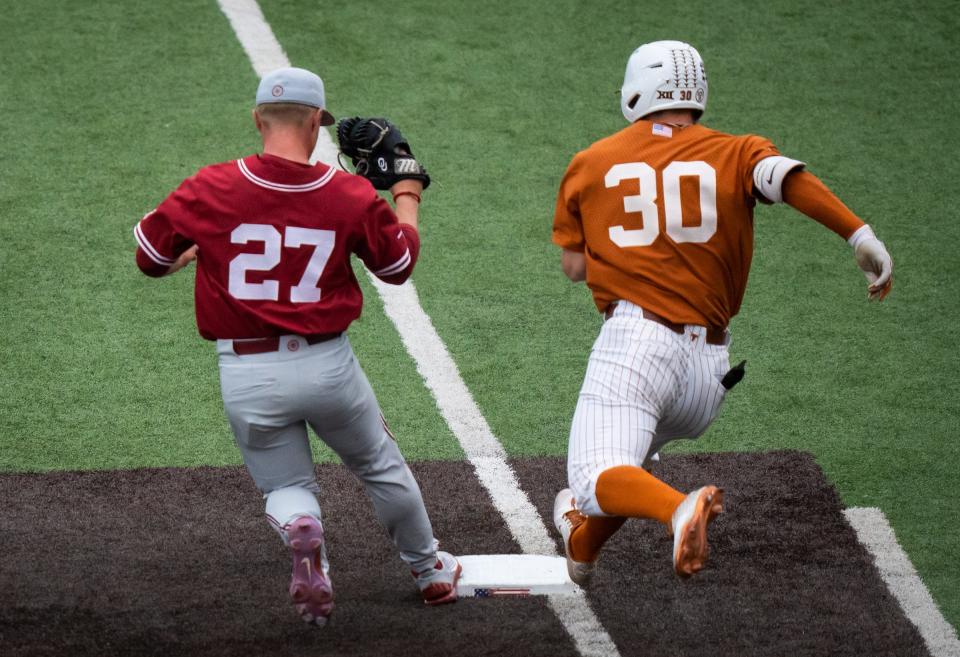 Texas' Eric Kennedy can't beat Oklahoma pitcher Braden Carmichael to first base in the fifth inning of OU's 9-6 win in the first game of Saturday's doubleheader. Texas' next two Big 12 series are on the road.