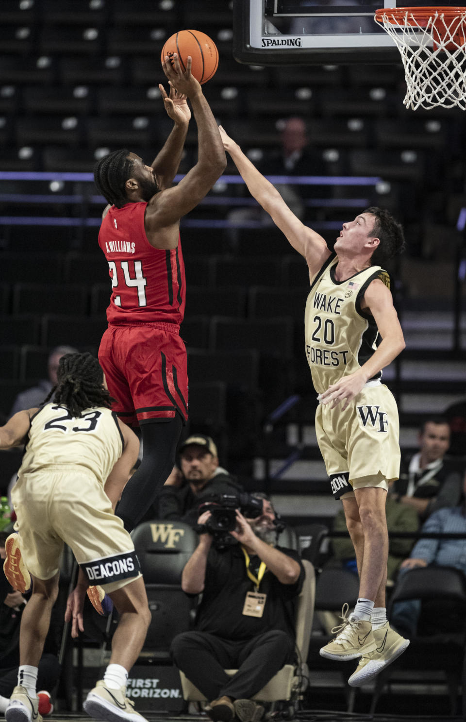 Rutgers' guard Austin Williams (24) shoots over Wake Forest guard Parker Friedrichsen (20) during the first half of an NCAA college basketball game on Wednesday, Dec. 6, 2023, at Joel Coliseum in Winston-Salem, N.C. (Allison Lee Isley/The Winston-Salem Journal via AP)