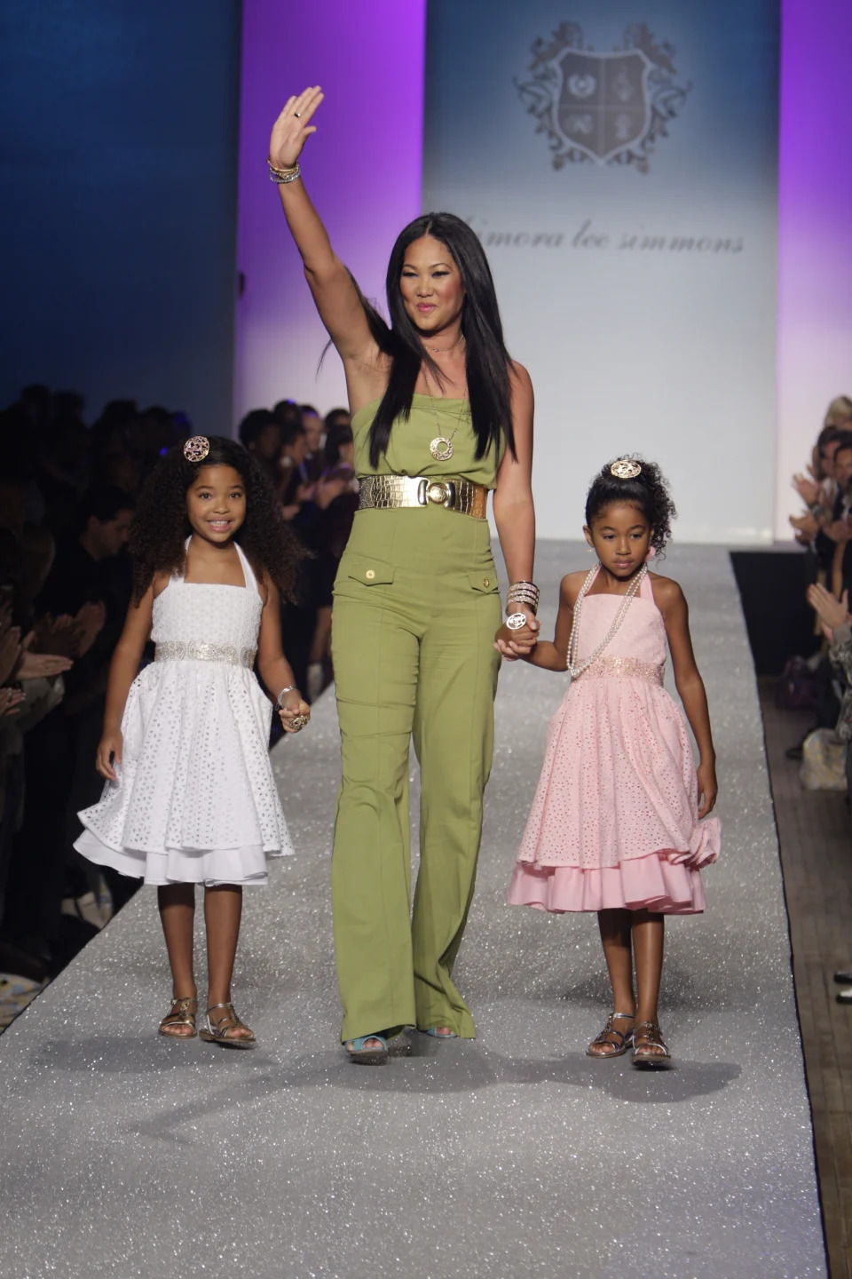 Designer KImora Lee Simmons and her daughter on the runway after Simmons' Baby Phat spring 2009 show at the Roseland Ballroom.