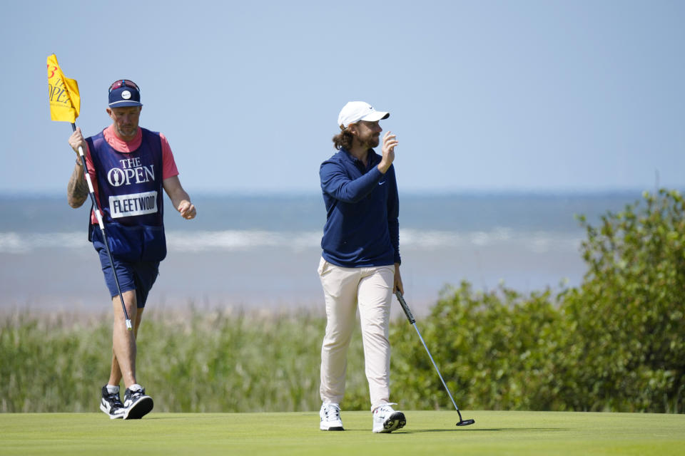 England's Tommy Fleetwood acknowledges the crowd after putting on the 13th greenon the first day of the British Open Golf Championships at the Royal Liverpool Golf Club in Hoylake, England, Thursday, July 20, 2023. (AP Photo/Jon Super)