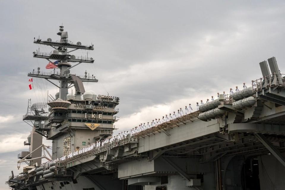 US Navy sailors man the rails USS Dwight D. Eisenhower