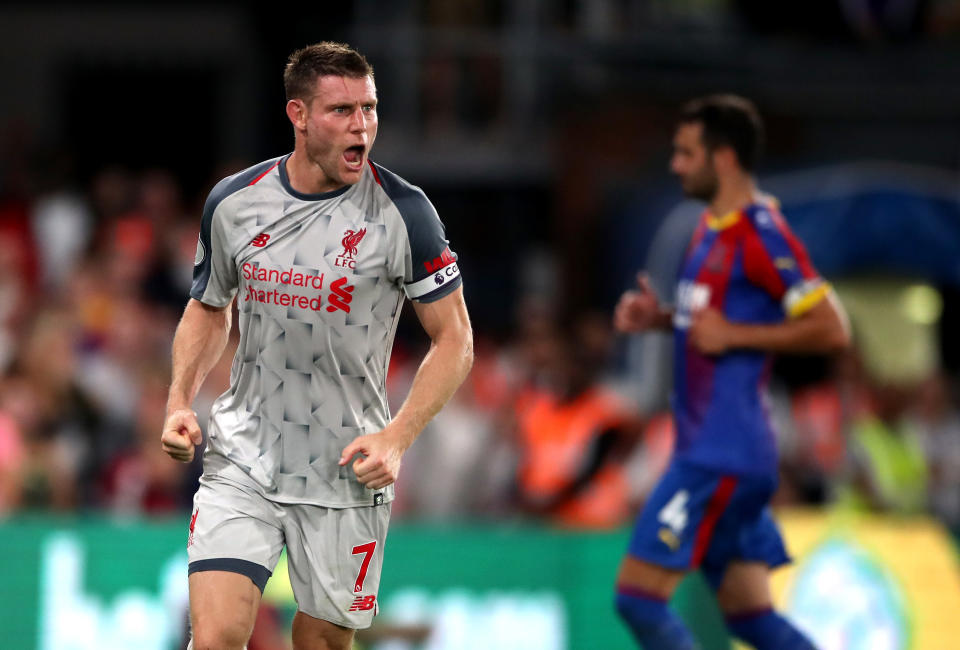 Liverpool’s James Milner celebrates scoring his side’s first goal of the game from the penalty spot.