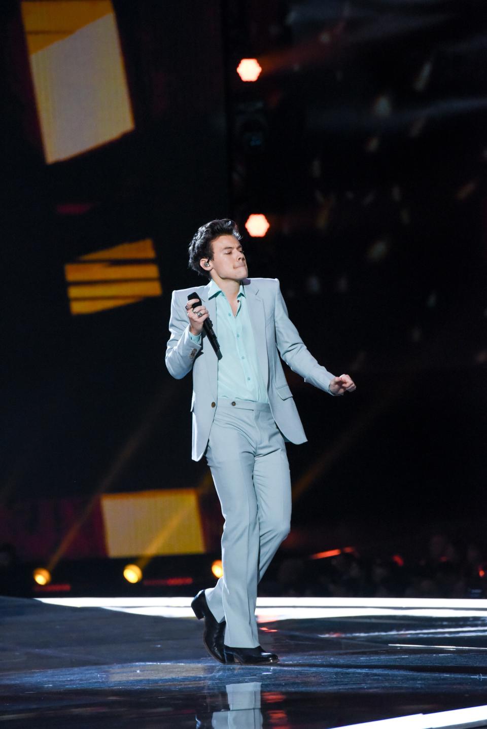 Harry should wear mint green more often! This grey suit and mint shirt look from his musical performance at the Victoria’s Secret Fashion Show is impeccable.