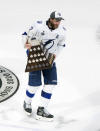 Tampa Bay Lightning defenseman Victor Hedman (77) carries the Conn Smythe Trophy after defeating the Dallas Stars to win the Stanley Cup in Edmonton, Alberta, on Monday, Sept. 28, 2020. (Jason Franson/The Canadian Press via AP)