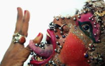 LONDON - NOVEMBER 11: Worlds most pierced woman Elaine Davidson poses for photographers at the photocall for the 100 millionth copy of the Guinness World Records in the Tate Modern on November 11, 2003 in London. (Photo by Bruno Vincent/Getty Images)