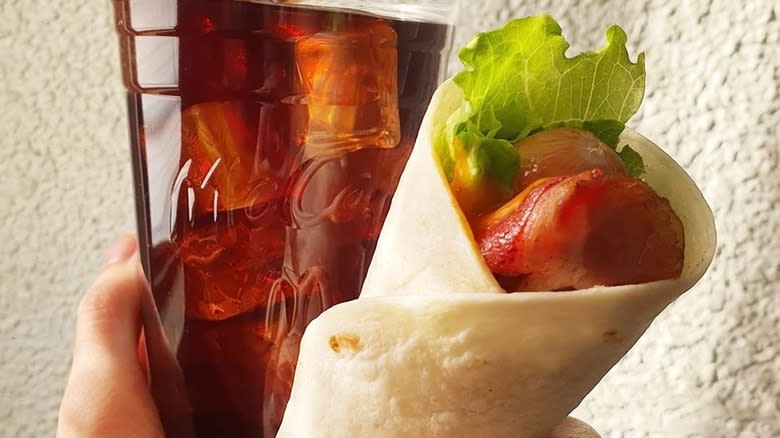 Hot dog snack wrap with a soft drink