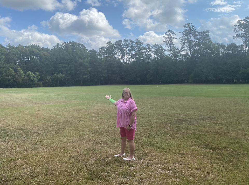 Peggy Jones in a grassy field.