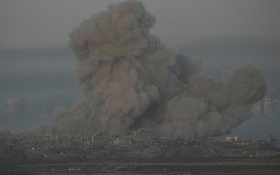 Smoke rises following an Israeli airstrike in the Gaza Strip moments before the start of the temporary ceasefire