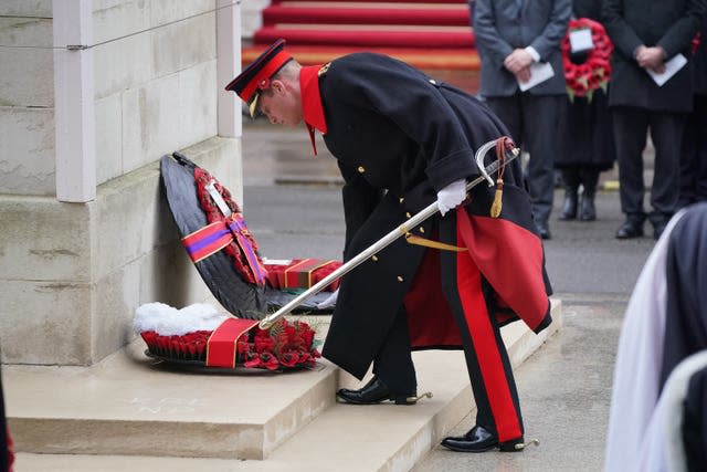 The Prince of Wales lays a wreath during the ceremony