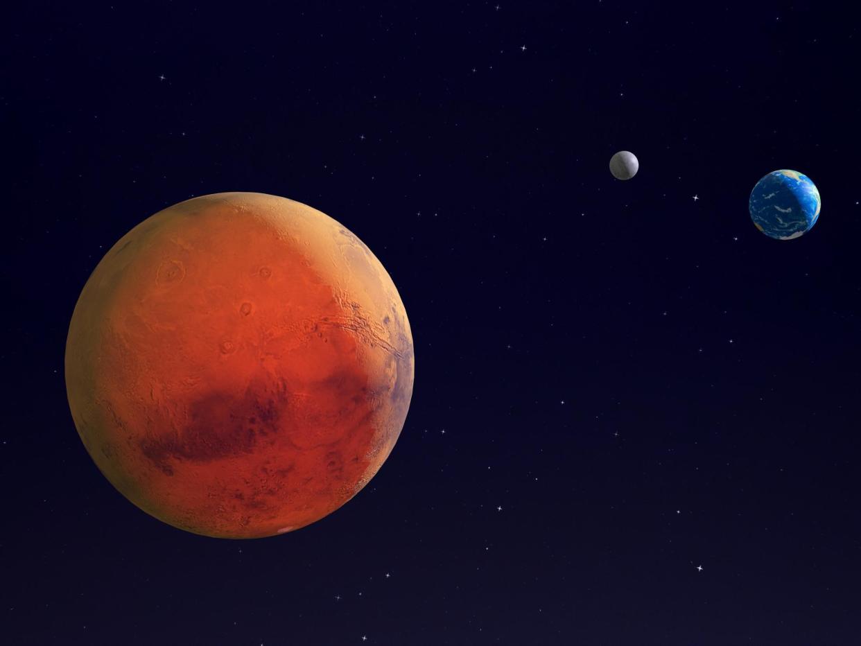 Mars, Earth and the Moon in space - 3d render - elements of this image furnished by NASA: Getty Images/iStockphoto