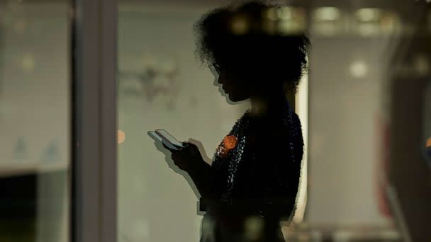 PHOTO: An undated stock photo shows the silhoutte of a person looking at their phone. (STOCK PHOTO/Getty Images)