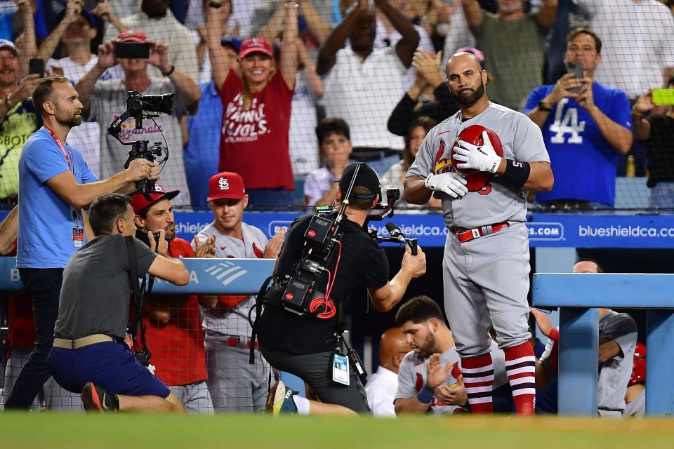 St. Louis Cardinals designated hitter Albert Pujols acknowledges the crowd after hitting his 700th career home run at Dodger Stadium.