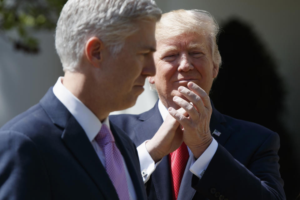 President Donald Trump applauds new Supreme Court Justice Neil Gorsuch during a public swearing-in ceremony for Gorsuch in the Rose Garden of the White House in Washington on April 10, 2017. (Photo: Evan Vucci/AP)