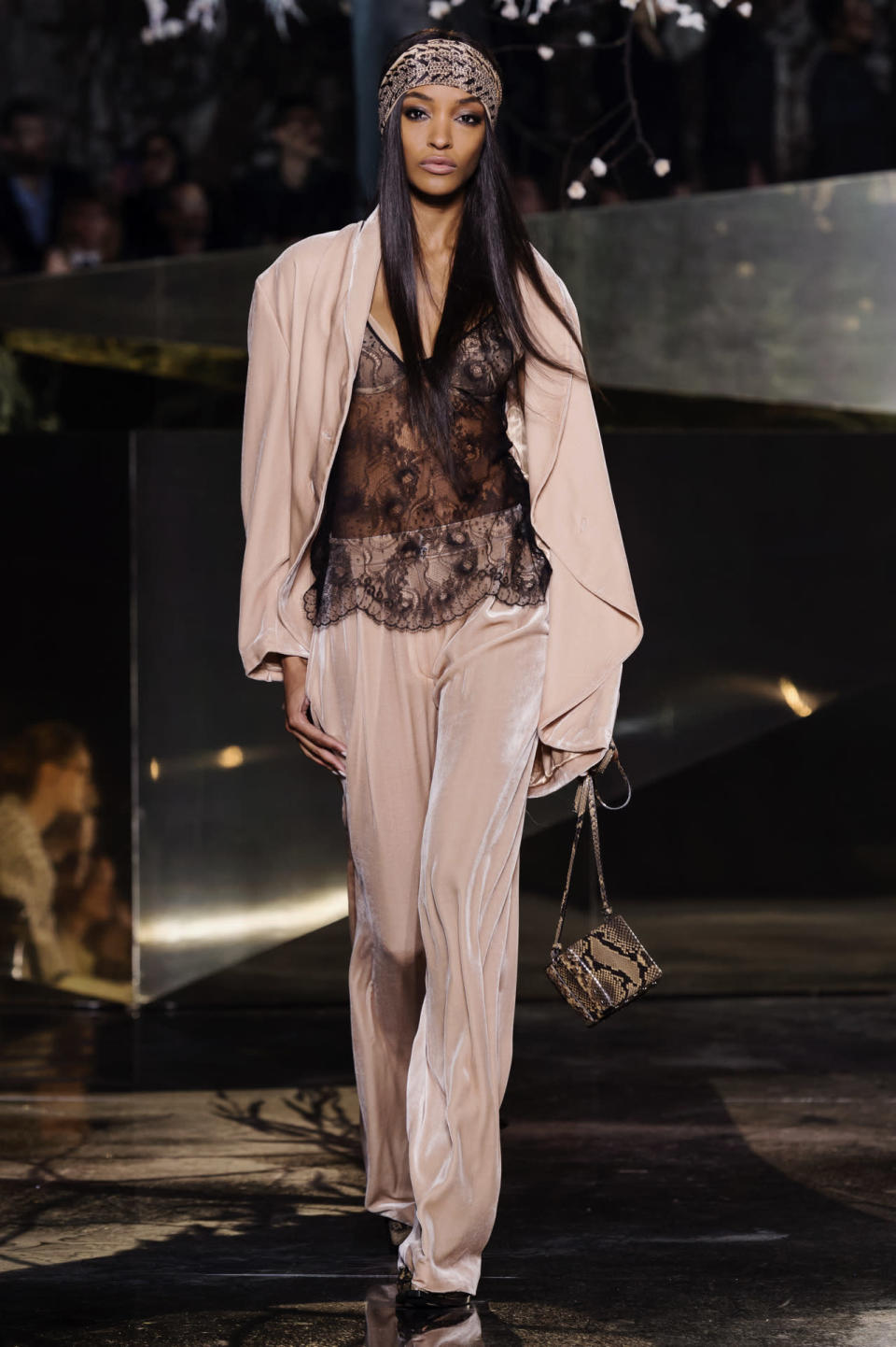 Another of the British supermodel’s looks included a velvet blush pink trouser suit and another sheer lace blouse. 