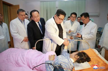 North Korean leader Kim Jong Un visits a hospital following a bus accident involving Chinese tourists in North Hwanghae province, in this undated photo released by North Korea's Korean Central News Agency (KCNA) in Pyongyang on April 24, 2018. KCNA/via Reuters