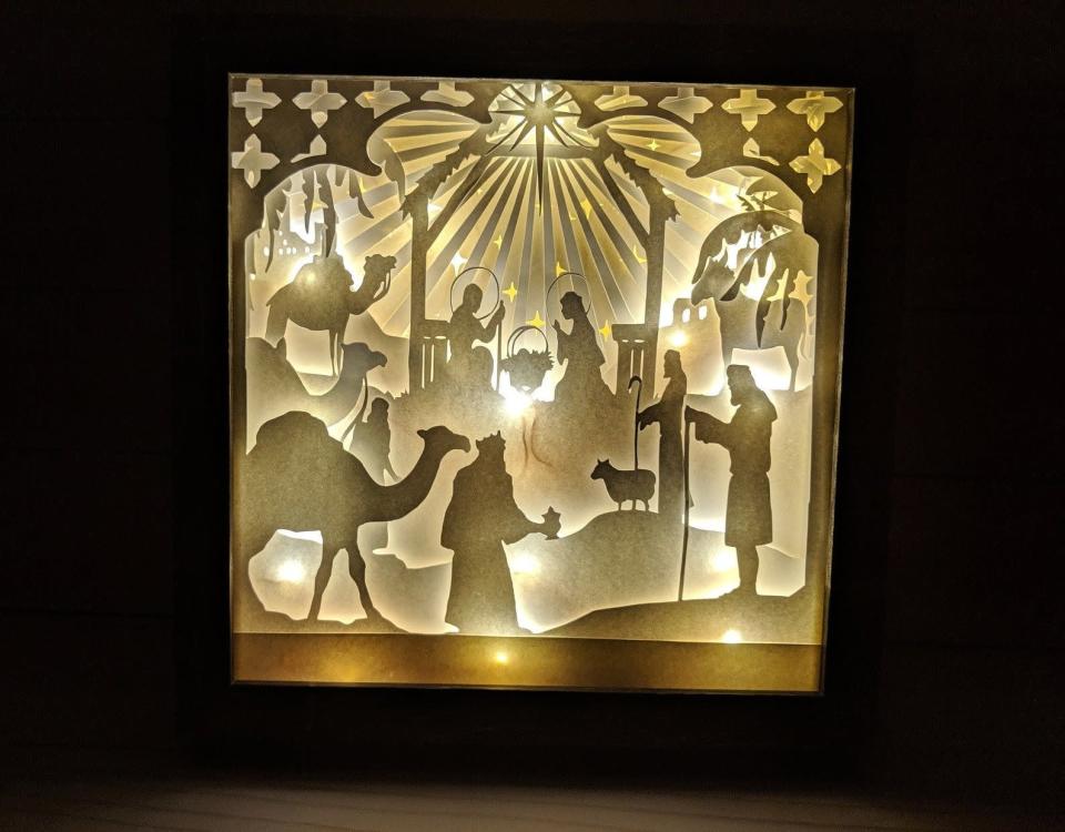 <p><strong>Pleasant Home Decor</strong></p><p>etsy.com</p><p><strong>$44.10</strong></p><p>This dazzling eight-inch-tall light-up shadow box nativity scene is made of intricately cut card stock. Choose from a black, white or wood grain frame to display it on your wall.</p>