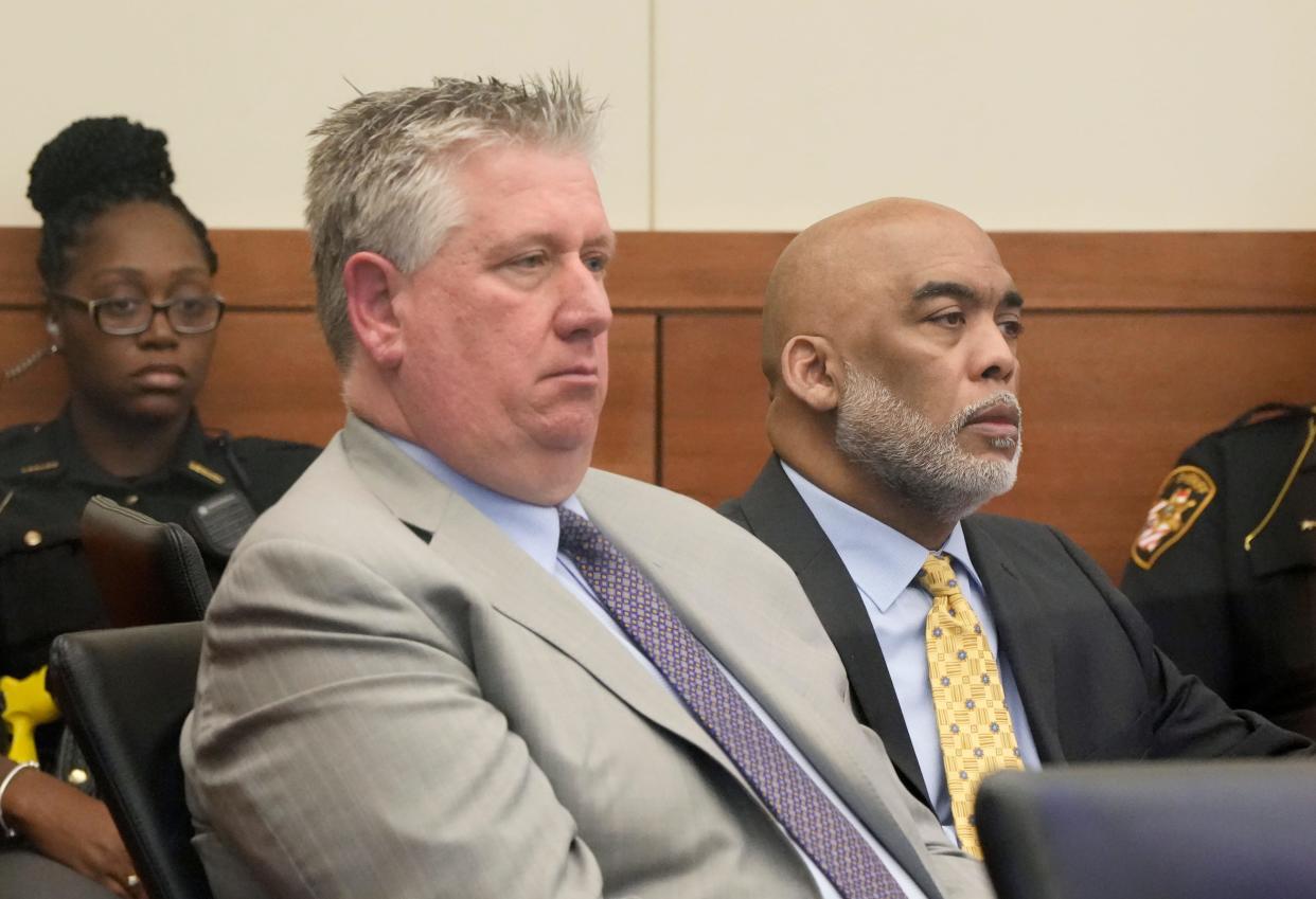 Andrew Mitchell, right, a former Columbus police vice officer, sits with his lead defense attorney, Mark Collins, left, on Tuesday during his trial in Franklin County Common Pleas Court on charges of murder and involuntary manslaughter in the shooting death of 23-year-old Donna Dalton Castleberry on Aug. 23, 2018.