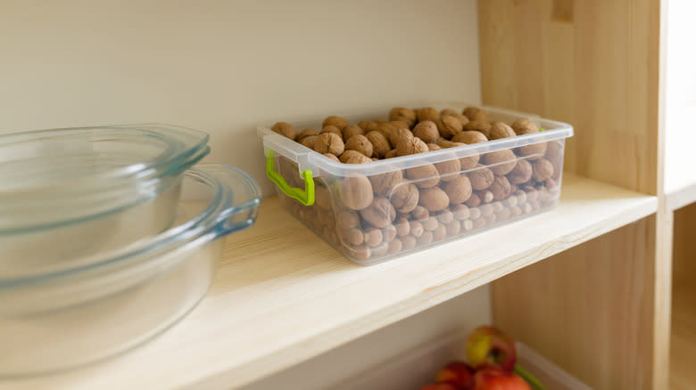 walnuts on shelf in container