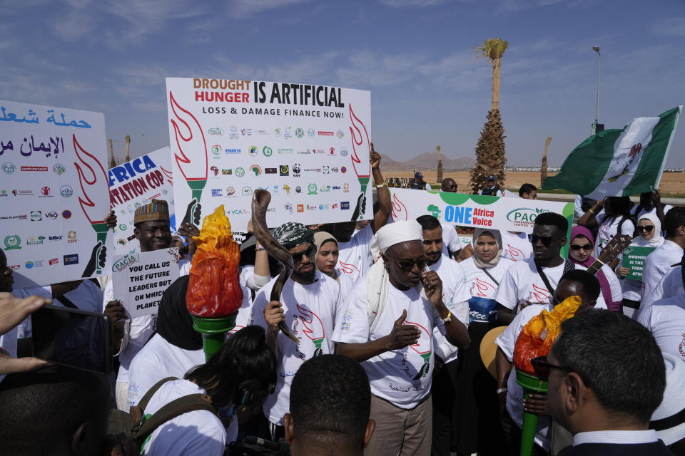 Demonstrators call for climate action on the African continent prior to the COP27 U.N. Climate Summit, Friday, Nov. 4, 2022, which start on Nov. 6, and is scheduled to end on Nov. 18, in Sharm el-Sheikh, Egypt. (AP Photo/Peter Dejong)