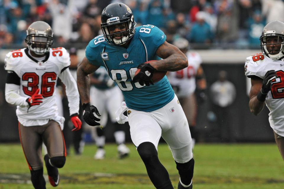 Jacksonville Jaguars tight end Marcedes Lewis catches a Blaine Gabbert pass on his fingertips and runs for 62-yards against the Tampa Bay Buccaneers at EverBank Field in Jacksonville, FL on Sunday. December 11, 2011.  [Bob Mack/Florida Times-Union]