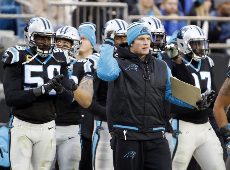 Luke Kuechly (blue hat) has sat out four straight games. (AP)