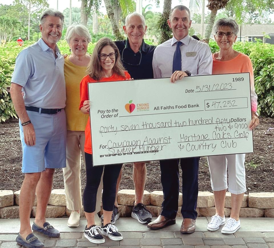 Heritage Oaks Golf & Country Club recently raised $47,252 for All Faiths Food Bank's Campaign Against Summer Hunger. From left, Dennis Fuhrman, Barbara Fraser, Victoria Hasselbring (All Faiths), Steve Ronis, Greg Hurst, and Jan Wilson.