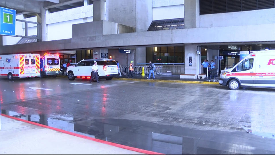 This image taken from video provided by Hawaii News Now shows the scene outside the international airport in Honolulu after nearly a dozen people were seriously injured when a flight to Hawaii hit severe turbulence on Sunday, Dec. 18, 2022. (Hawaii News Now via AP)