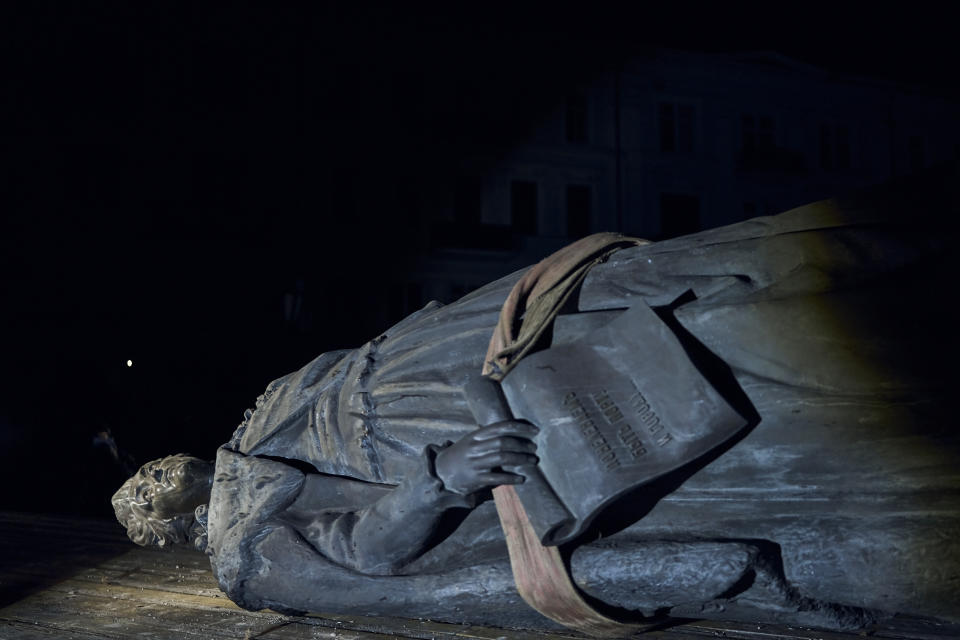 The monument to Catherine II, also known as "Monument to the Founders of Odesa" is seen placed down in Odesa, Ukraine, early Thursday, Dec. 29, 2022. The decision to dismantle the monument consisting of sculptures of Russian Empress Catherine II and her associates was made recently by Odesa residents by electronic voting. (AP Photo/LIBKOS)