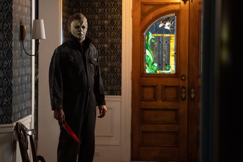 Michael Myers in a house holding a knife