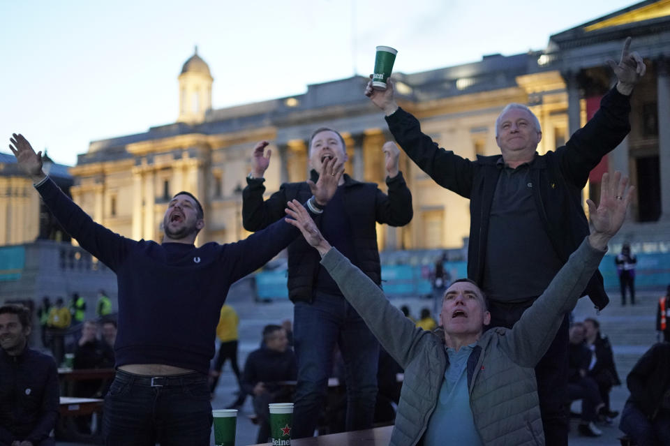 England supporters react in the fan zone in Trafalgar Square in London, Tuesday, June 22, 2021 during the Euro 2020 soccer championship group D match between England and the Czech Republic at Wembley Stadium. (AP Photo/Alberto Pezzali)