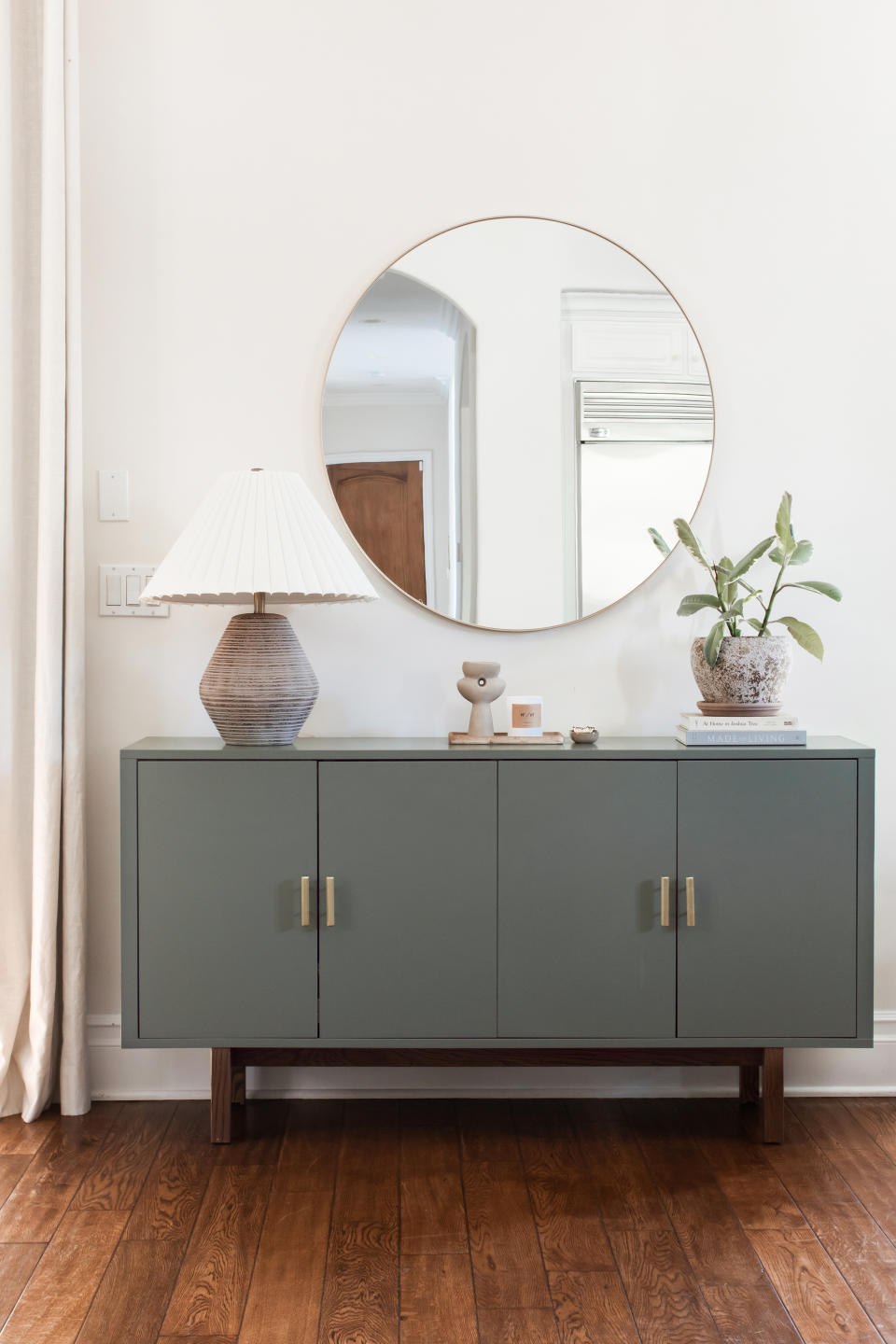 dark grey cabinet with grey lamp on top