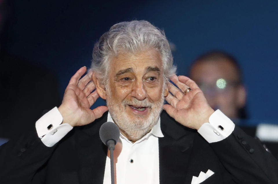 Opera star Placido Domingo listens to applause at the end of a concert in Szeged, Hungary, Wednesday, Aug. 28, 2019. Domingo continued his calendar of European engagements unabated despite allegations of sexual harassment, appearing Wednesday at a concert in southern Hungary to inaugurate a sports complex for a local Catholic diocese.(AP Photo/Laszlo Balogh)