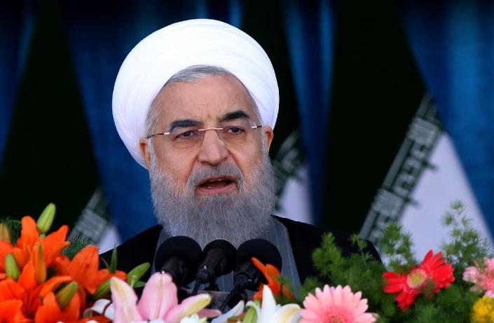 President Hassan Rouhani faces a tough battle for re-election on May 19 as conservative opponents attack his failure to revive Iran's stagnant economy (AFP Photo/Atta KENARE)