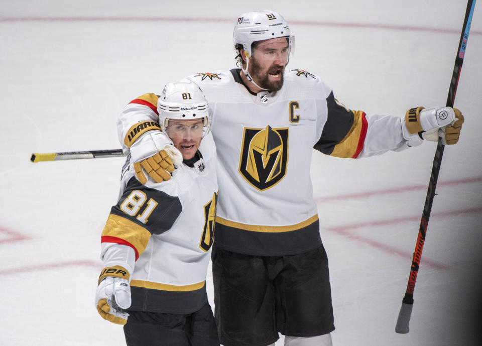 Vegas Golden Knights' Jonathan Marchessault (81) celebrates with Mark Stone after scoring against the Montreal Canadiens during the third period of an NHL hockey game Saturday, Nov. 5, 2022, in Montreal. (Graham Hughes/The Canadian Press via AP)