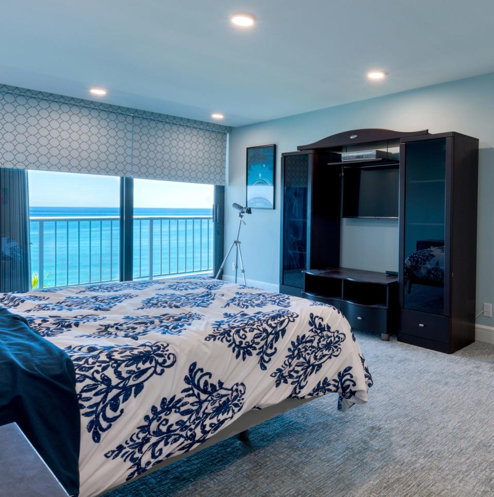 The condo’s windows and glass doors, including the ones in the bedrooms, are equipped with electronically controlled shades.