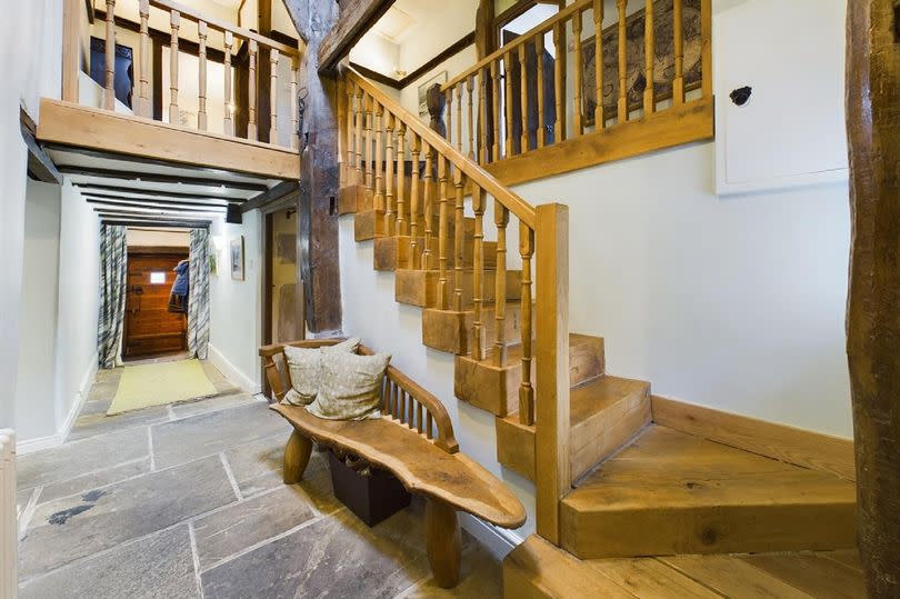 Period features - a beautiful oak staircase gives access to the first floor