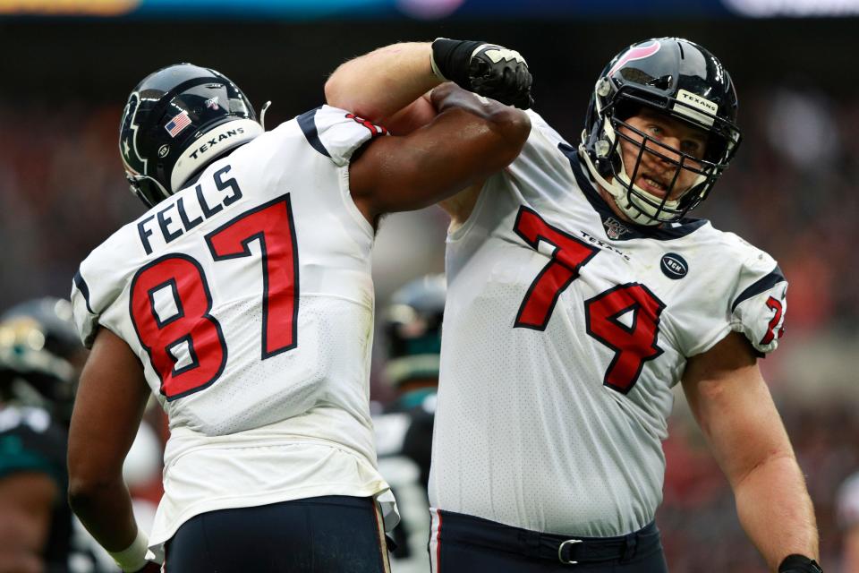 Houston Texans tight end Darren Fells (87) celebrates his touchdown against the Jacksonville Jaguars with Houston Texans offensive tackle Max Scharping (74) during the first half of an NFL football game at Wembley Stadium, Sunday, Nov. 3, 2019, in London. (AP Photo/Ian Walton)