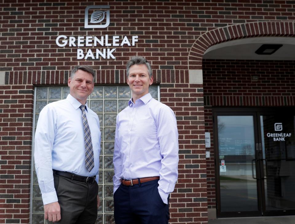 David and Michael Krutz are pictured outside GreenLeaf Bank on May 6, 2022, in Greenleaf, Wis.