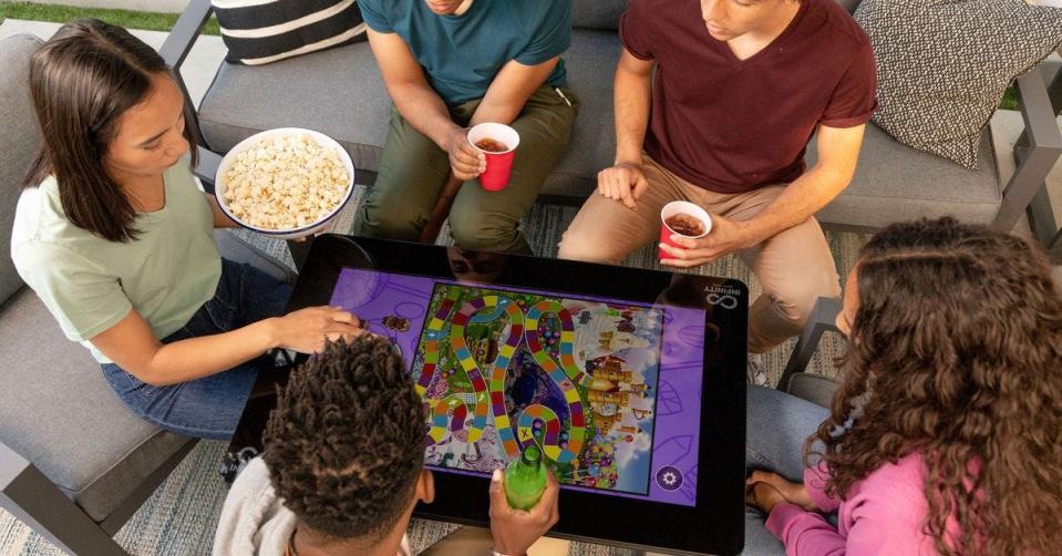 The Arcade1Up Infinity Game Table is a coffee table with a giant tablet top loaded with your favorite classic board games.