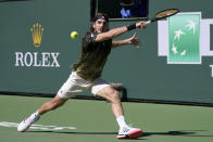 Stefanos Tsitsipas, of Greece, returns to Nikoloz Basilashvili, of Georgia, at the BNP Paribas Open tennis tournament Friday, Oct. 15, 2021, in Indian Wells, Calif. (AP Photo/Mark J. Terrill)