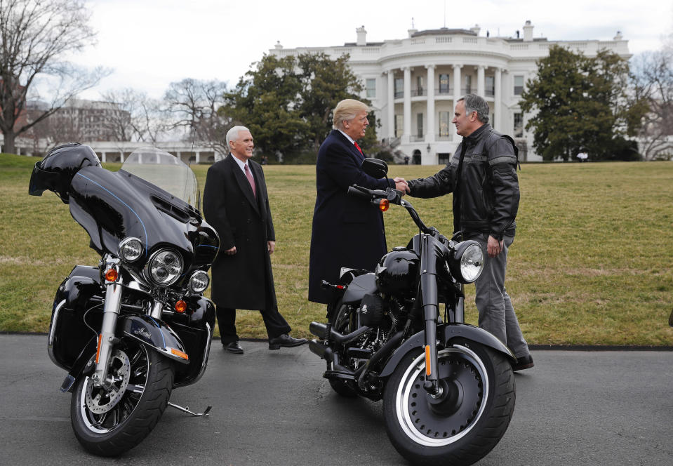 President Donald Trump and Vice President Mike Pence greet Harley Davidson President and CEO Matthew S. Levatich on the South Lawn of the White House in Washington in 2017. (AP Photo/Pablo Martinez Monsivais)