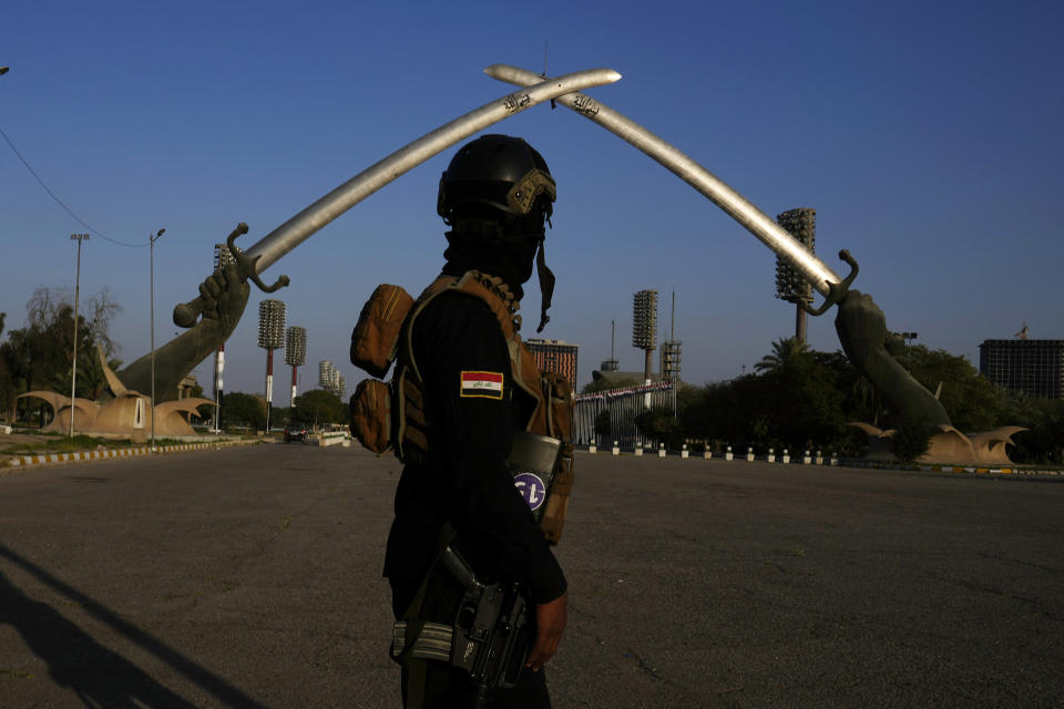 An Iraqi soldier passes under the Victory Arch monument built by former Iraqi President Saddam Hussein n Baghdad, Iraq, Tuesday, Feb 28, 2023. It was buuilt in 199889 to commemorate those killed in the Iraq's war with Iran in the 1980s. (AP Photo/Hadi Mizban)