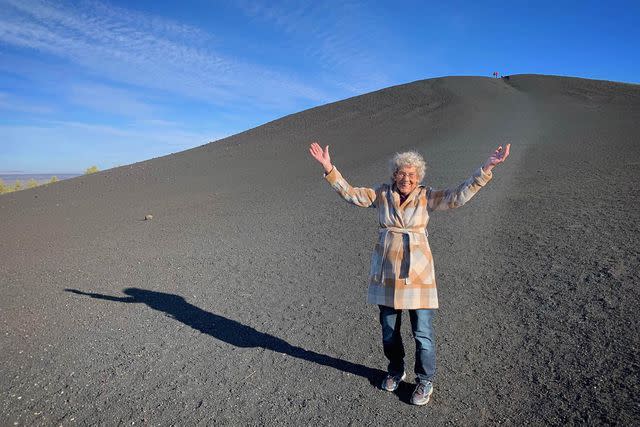 <p>Brad Ryan/Courtesy of Grandma Joy's Road Trip @grandmajoysroadtrip</p> Grandma Joy standing in Craters of the Moon National Monument, Idaho