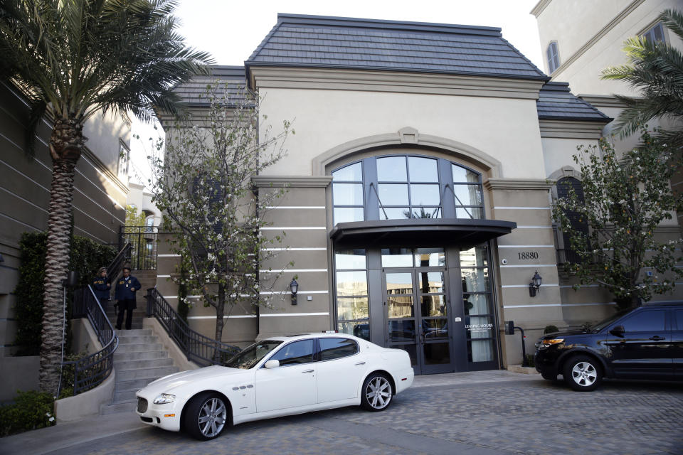 FILE - This March 3, 2015 file photo shows an upscale apartment complex where authorities say a birth tourism business charged pregnant women $50,000 for lodging, food and transportation, after it was raided in Irvine, Calif. On Thursday, Jan. 31, 2019, authorities announced they have charged 20 people in an unprecedented crackdown on businesses that helped hundreds of Chinese women travel to the United States to give birth to American citizen children. (AP Photo/Jae C. Hong, File)