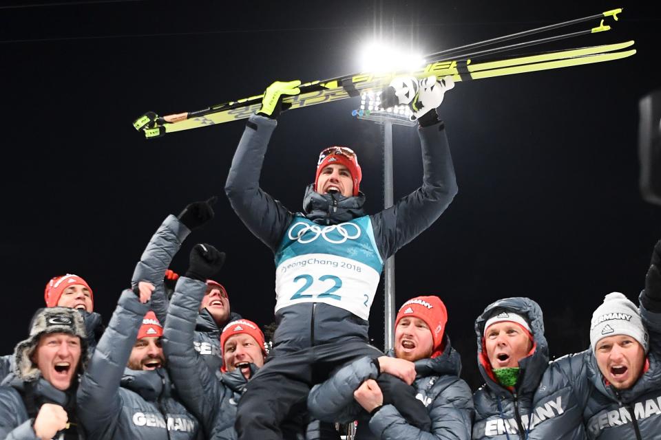 <p>Germany’s Arnd Peiffer is carried by team members as they celebrate his gold win during the victory ceremony following the men’s 10km sprint biathlon event during the Pyeongchang 2018 Winter Olympic Games on February 11, 2018, in Pyeongchang. / AFP PHOTO / FRANCK FIFE </p>